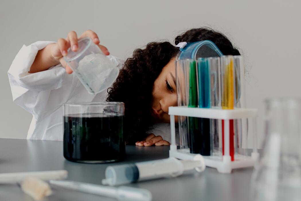 Girl Doing Science Experiment with Dyes